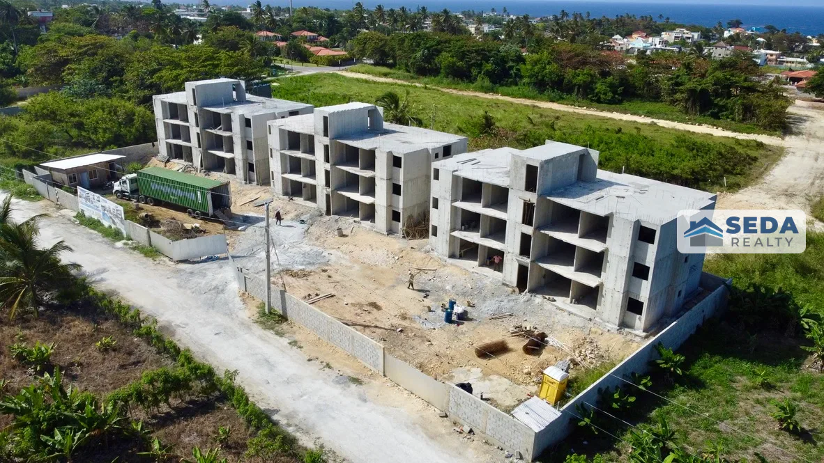 Side aerial view of the Brisas Residences buildings during construction